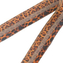 Load image into Gallery viewer, Leopard print long body band displayed on the ground showing the latex grip strip inside
